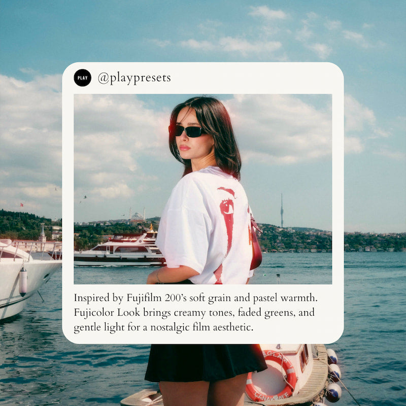 Woman standing by water with boats and a scenic background edited with Fujicolor Look Video LUTs.