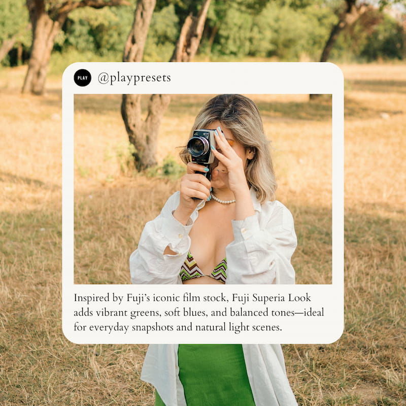 Woman holding a camera in a field edited with Fuji Superia Look Video LUTs.