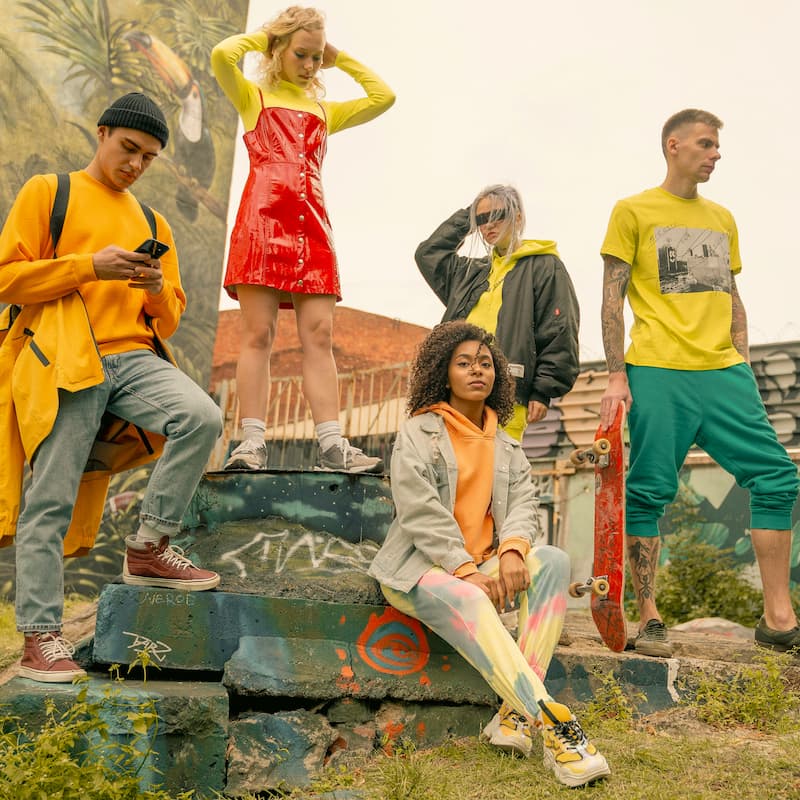 Final image of a group of friends in an urban street scene edited with Kodak Ektar Look Lightroom preset, highlighting saturated tones and bold contrast in daylight city setting